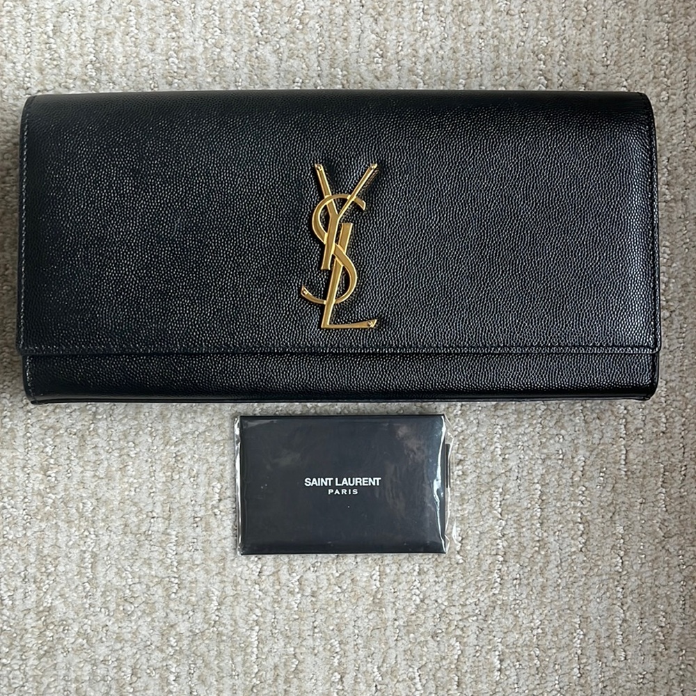 Grain De Poudre Classic Monogram Cassandre Clutch. Authenticity card included.